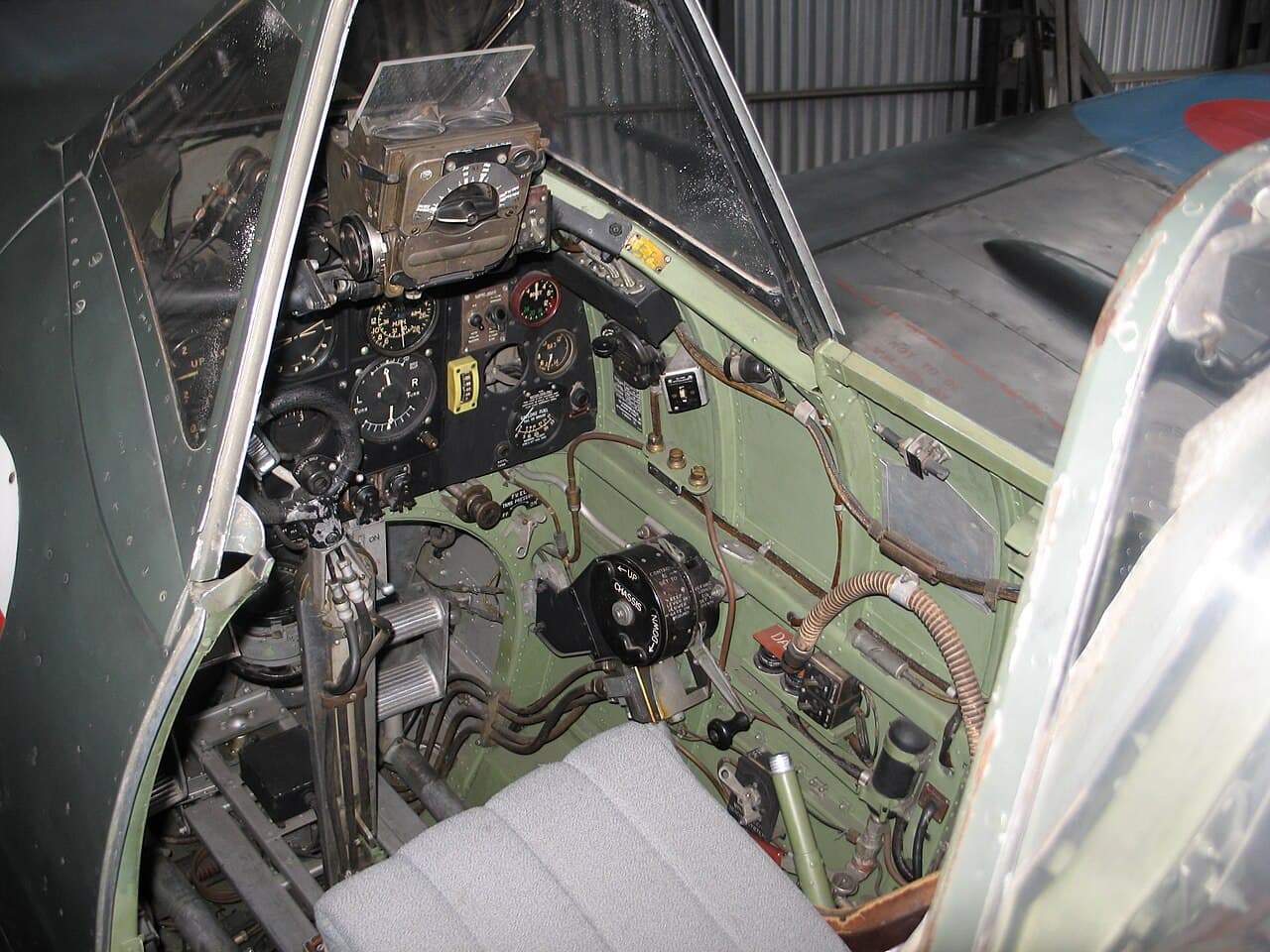 Interior view of a Spitfire cockpit showing instruments and controls