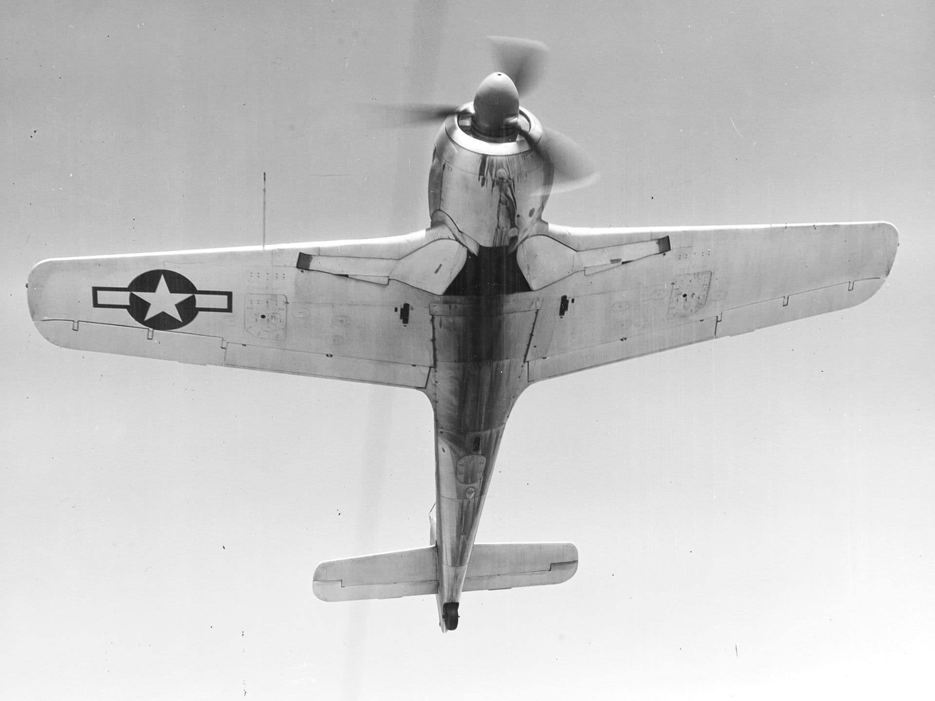 Captured Focke-Wulf Fw 190A in flight during Allied evaluation, belly view showing radial engine cowling
