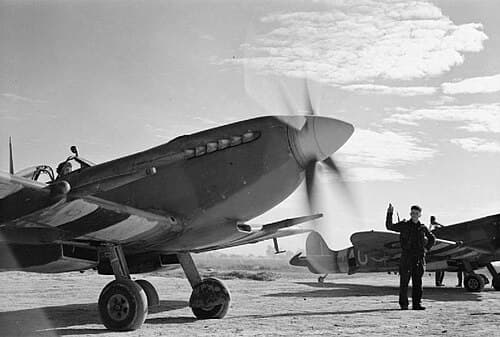 Spitfire of the 2nd Tactical Air Force with invasion stripes in Normandy