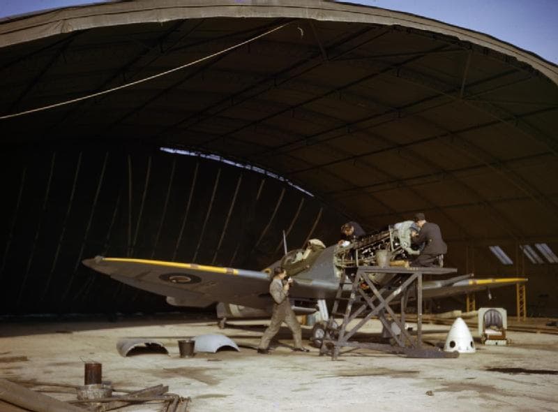 Spitfire Mk IX undergoing engine maintenance at an RAF station, 1942