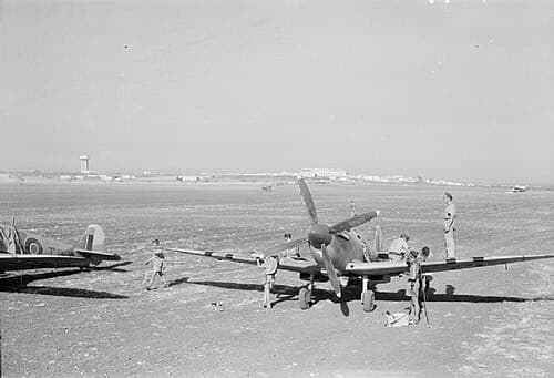 Spitfire Mk IX at a Mediterranean airfield with ground crew