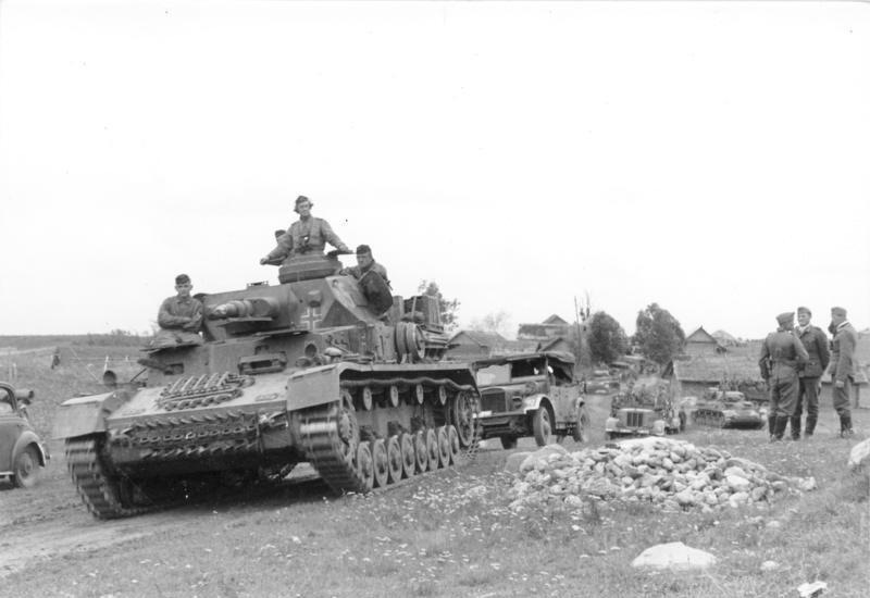 German Panzer IV tank advancing through Russian terrain during the Battle of Smolensk in 1941