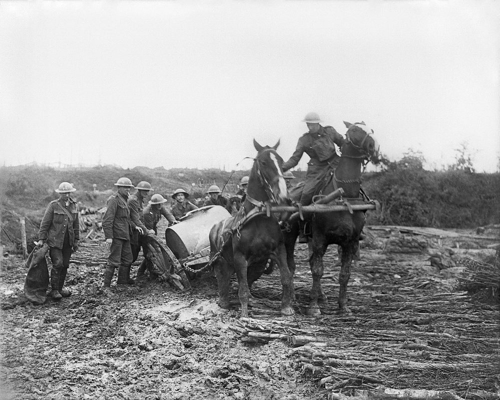 Australian infantry wearing small box respirator gas masks in the mud near Ypres during the Battle of Passchendaele 1917