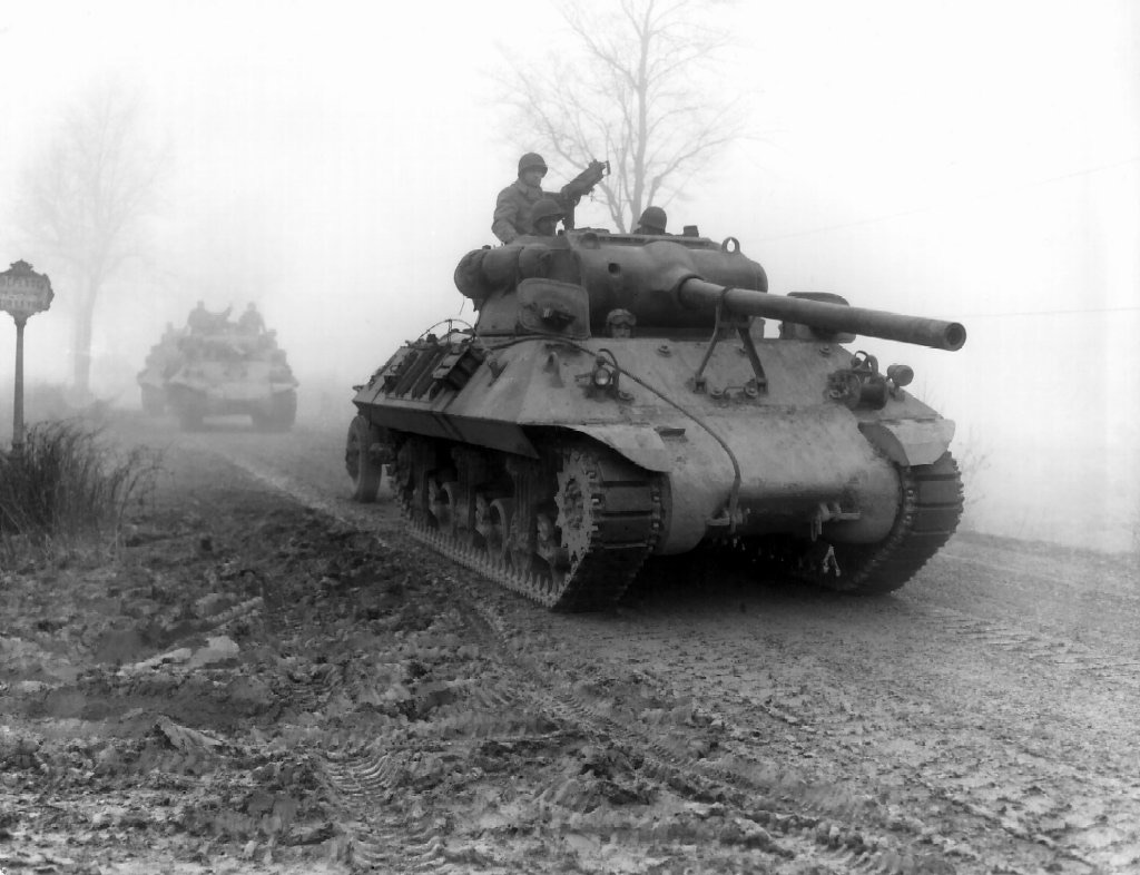 American tank destroyers advancing through the snow during the Battle of the Bulge in winter 1944-1945