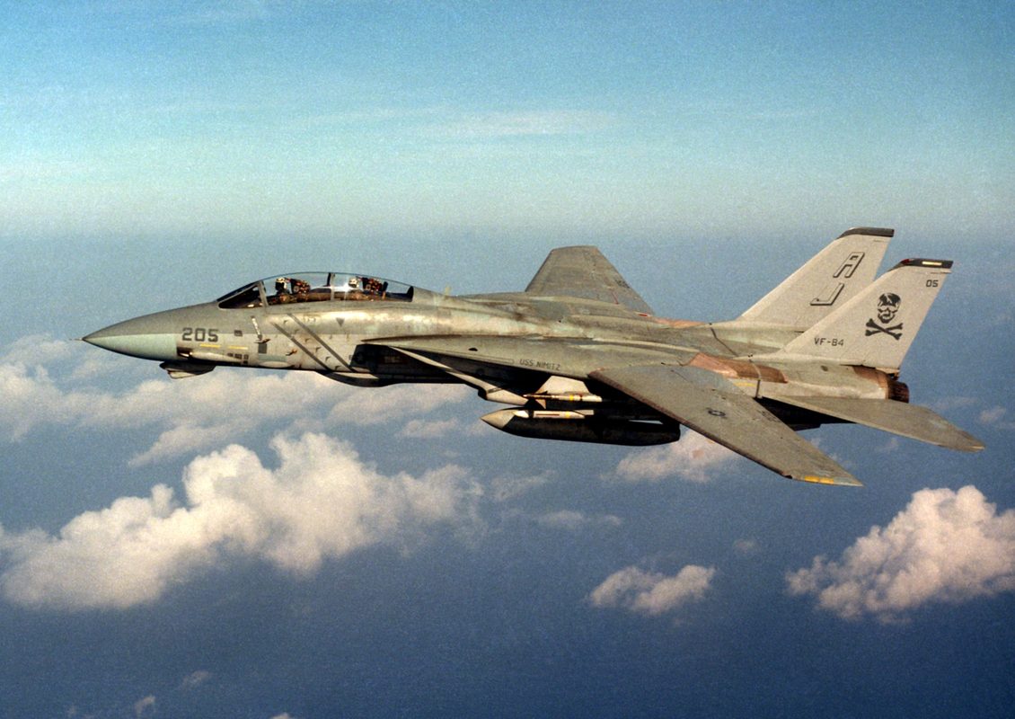 F-14 Tomcat with variable-sweep wings extended launching from a carrier