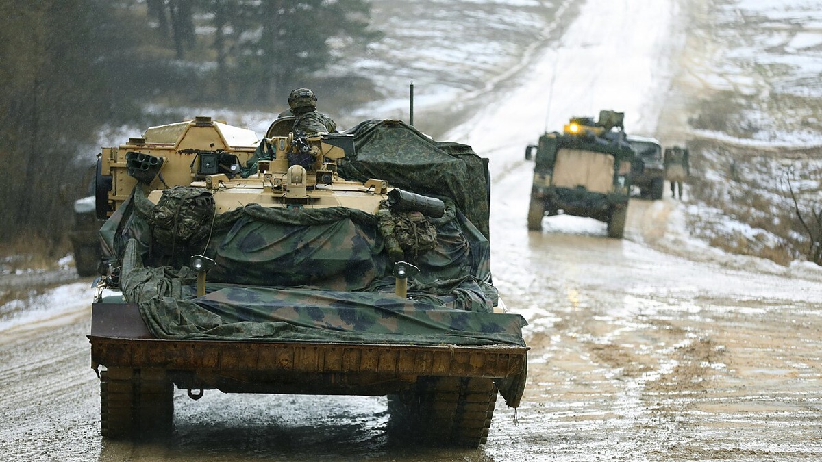 M1150 Assault Breacher Vehicle clearing obstacles with mine plow and line charges