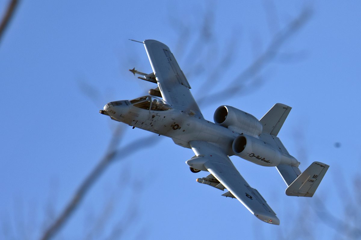 A-10 Thunderbolt II soaring through the sky, demonstrating the aircraft's stable, low-speed flight characteristics ideal for close air support