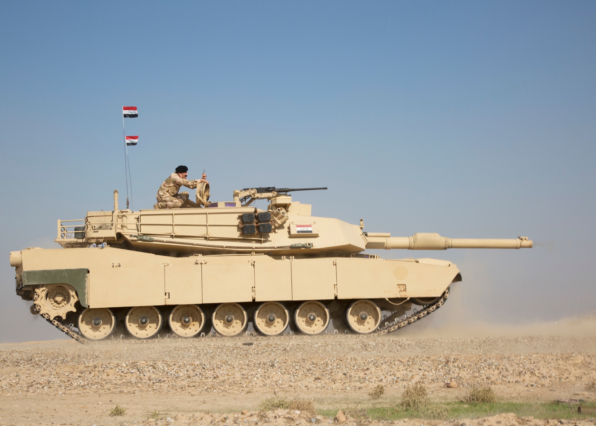 Column of M1A1 Abrams tanks advancing through the desert during the 100-hour ground war of Operation Desert Storm