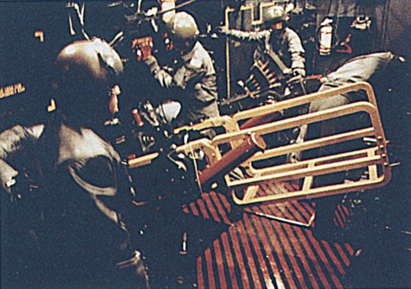 Crew loading 105mm rounds inside an AC-130U gunship