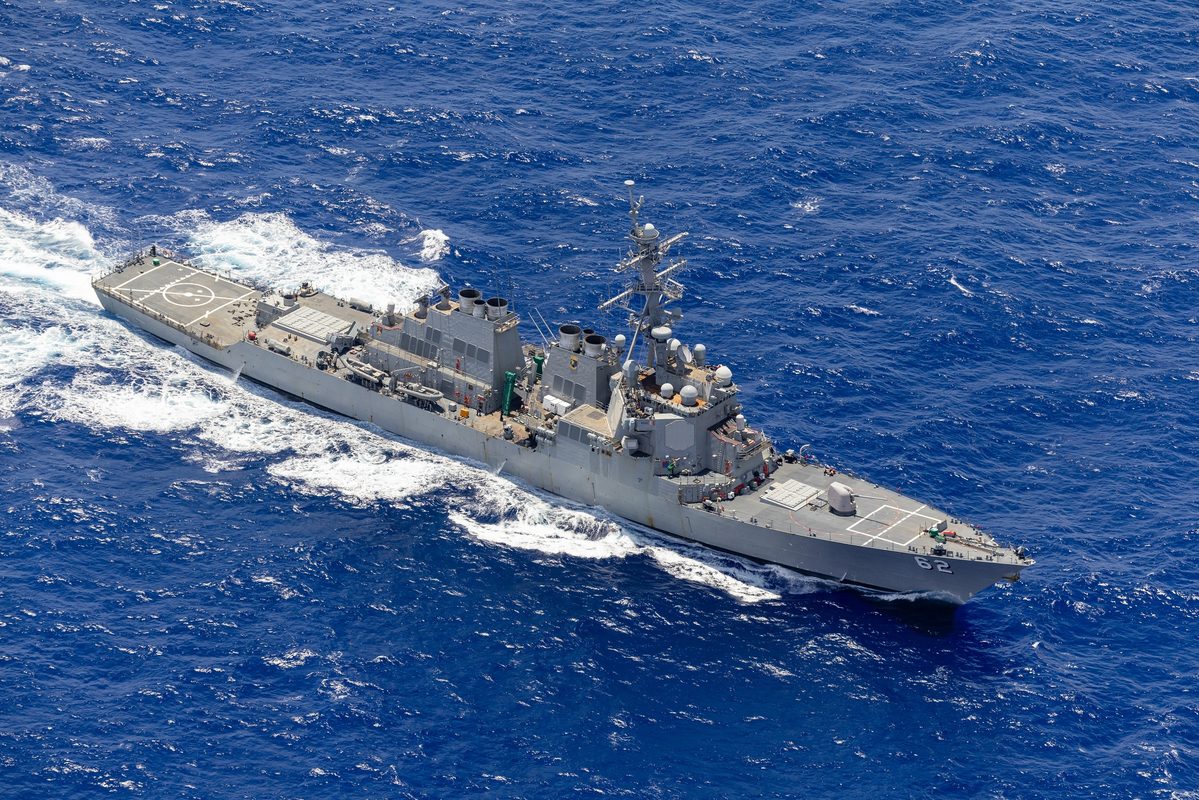 Arleigh Burke-class destroyer underway at sea with Aegis radar panels visible on superstructure and Mk 41 VLS forward
