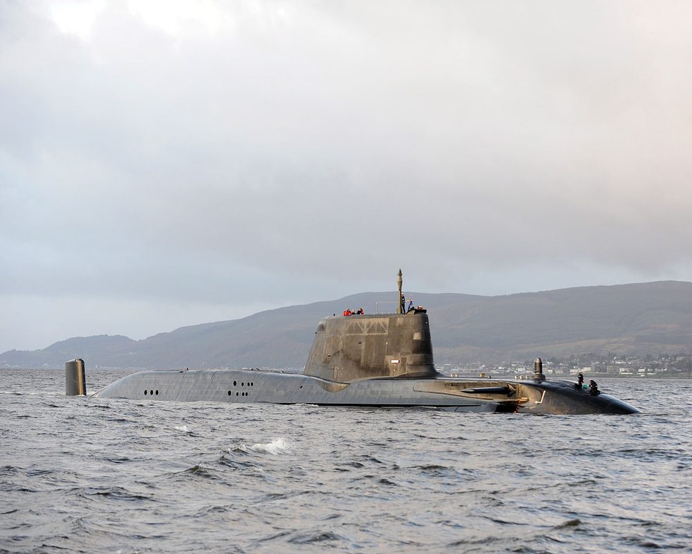 HMS Astute at sea showing the conning tower and hull profile from the surface