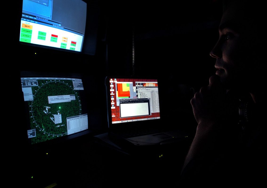 Fire control technician monitoring radar screens aboard the Virginia-class submarine USS Virginia