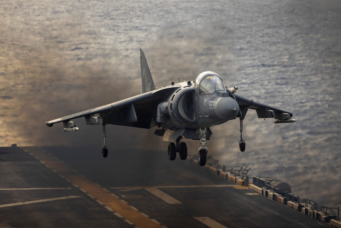 AV-8B Harrier II hovering with nozzles rotated downward during a vertical landing