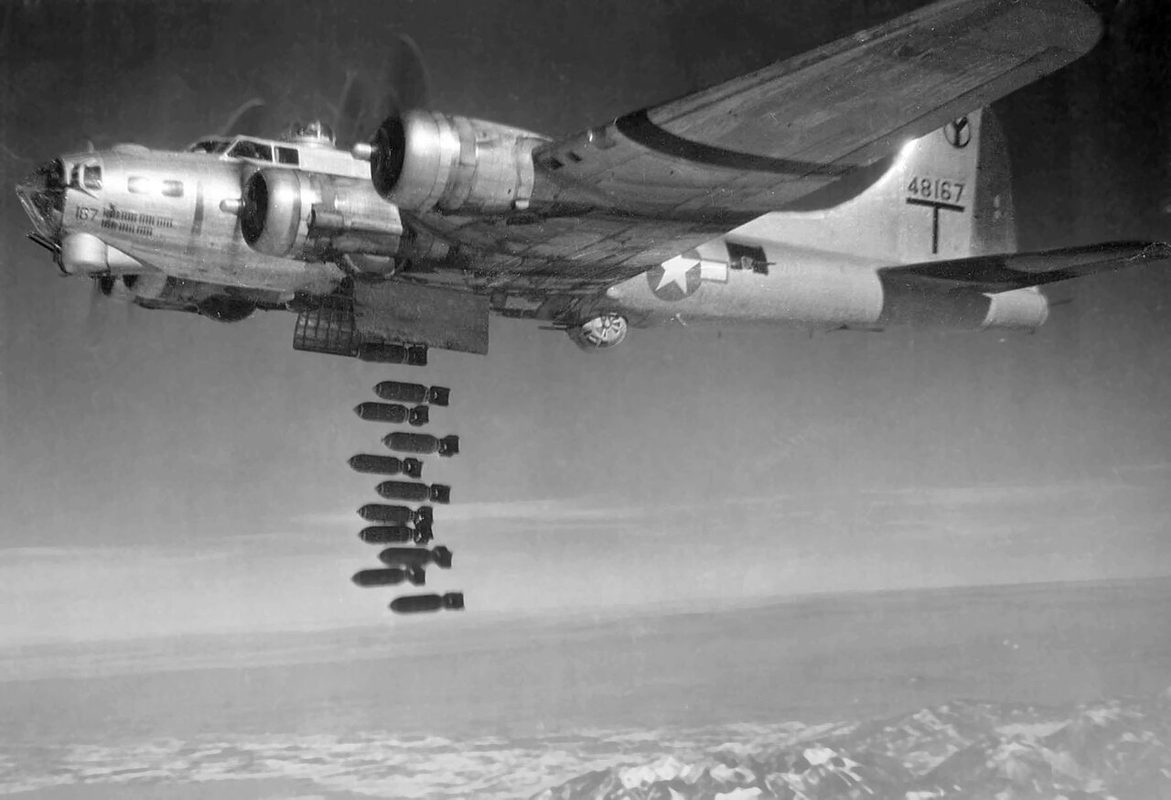 B-17G releasing bombs from its open bomb bay over a target