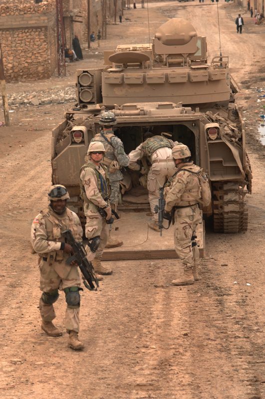 M2A2 Bradley ODS infantry fighting vehicle in Ukrainian service moving through a muddy field during combat operations