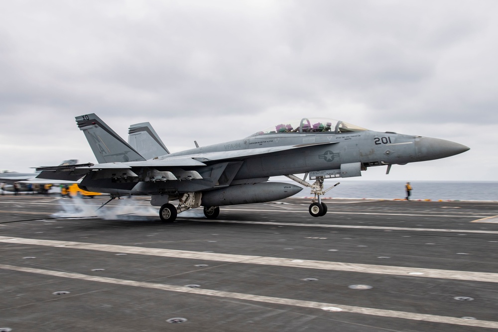Naval vessels conducting electronic warfare and defense operations