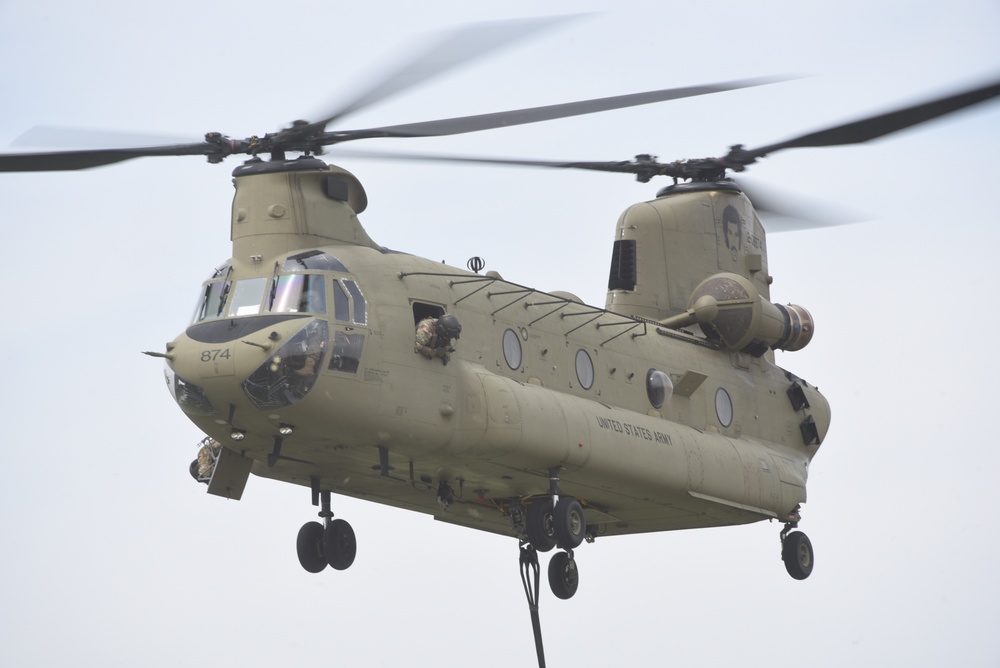 CH-47 Chinook helicopter being transferred between facilities for maintenance at an Air National Guard base