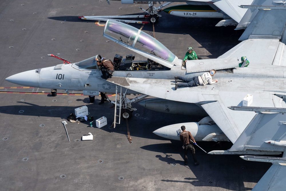 Sailors conduct flight deck operations aboard a U.S. Navy aircraft carrier