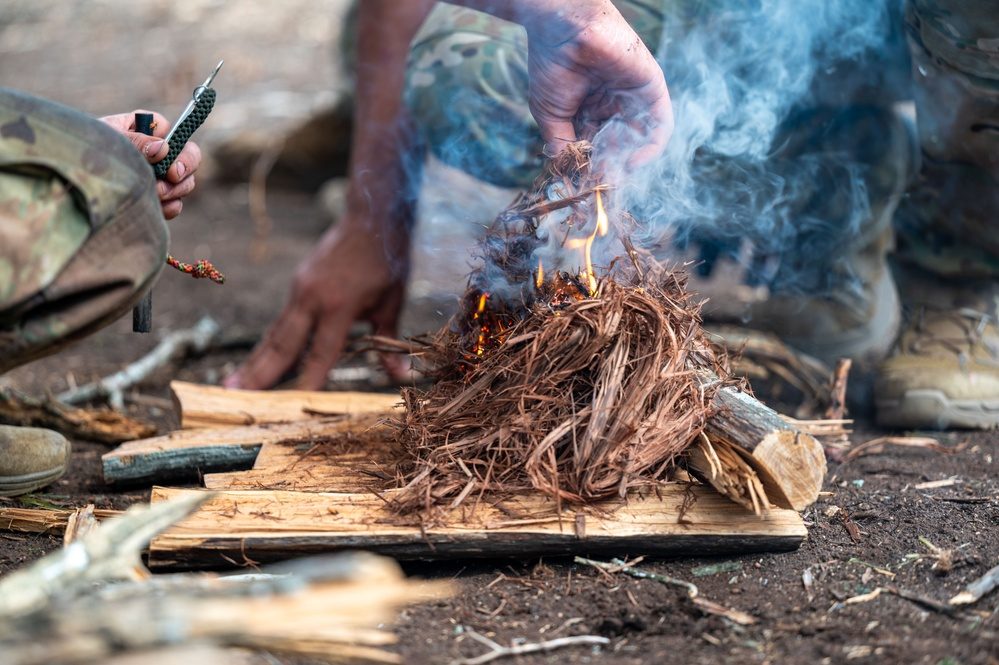 SERE school candidates participate in field survival training exercises
