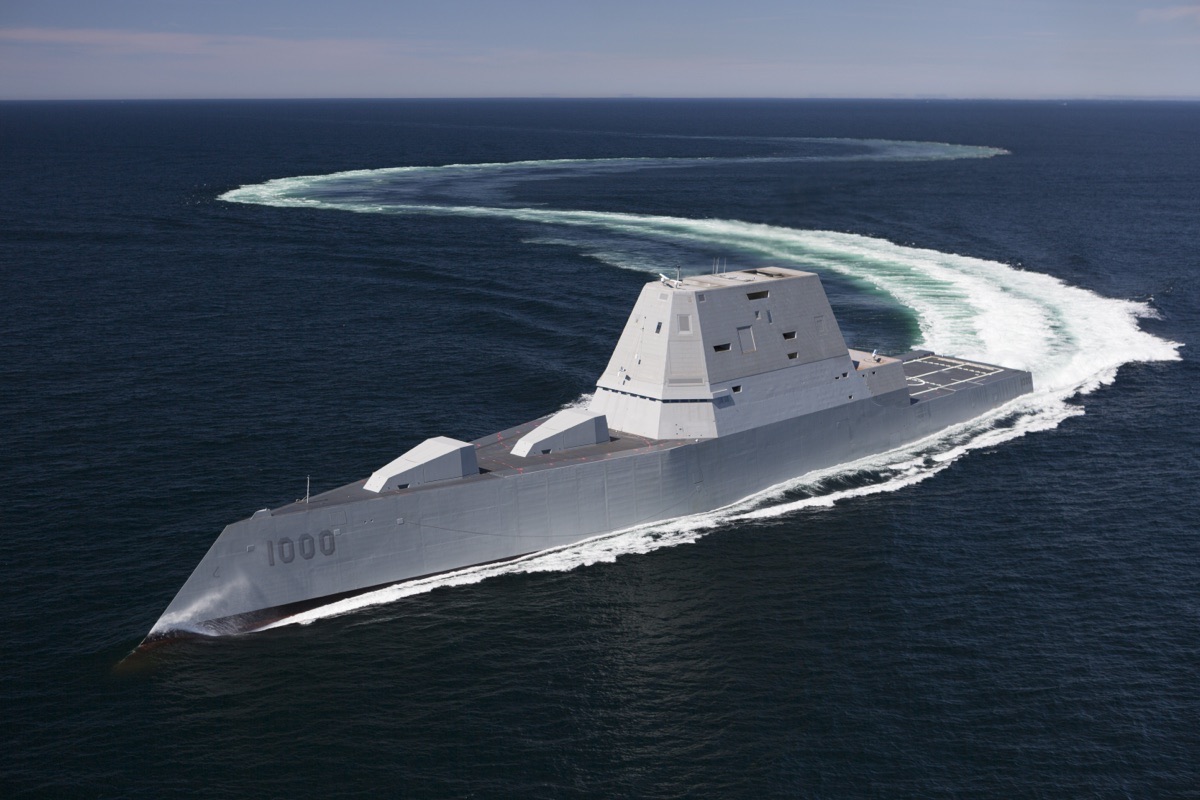 DDG-1000 Zumwalt stealth destroyer at sea, showing its distinctive tumblehome hull and angular superstructure designed to minimize radar cross-section