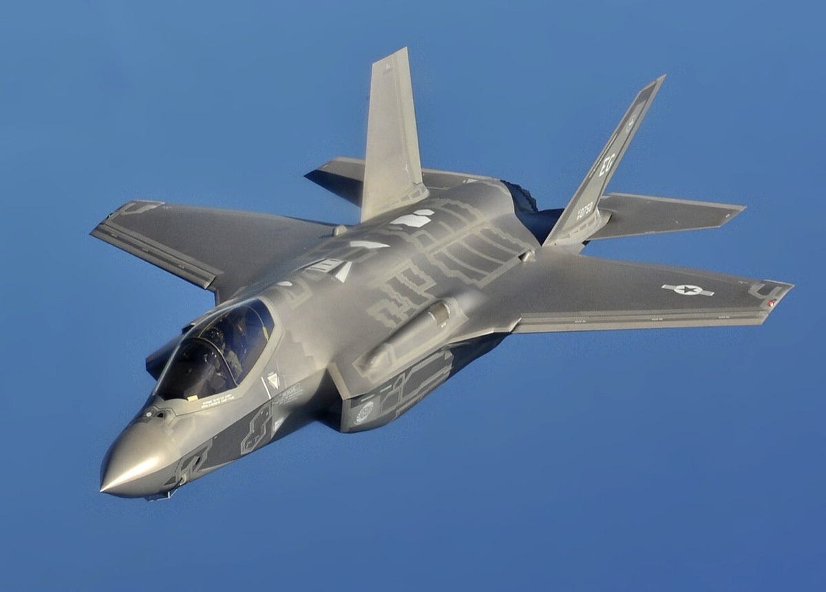 F-35A Lightning II in flight during a training exercise, showing the aircraft's sleek stealth design from a forward quarter angle