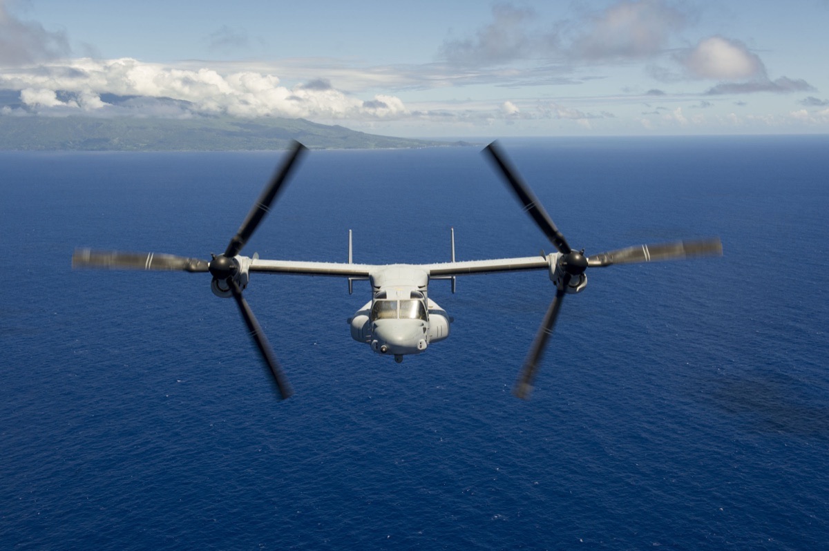 V-22 Osprey tiltrotor aircraft in flight with its engine nacelles tilted in airplane mode for high-speed cruise