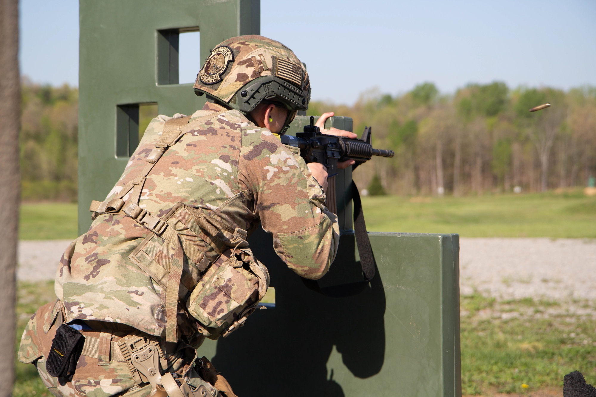 Military personnel examining robotic and autonomous systems