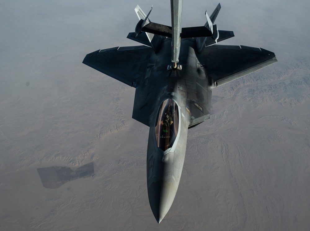 F-22 Raptor receiving aerial refueling from a KC-10 Extender tanker aircraft over the skies of Iraq during Operation Inherent Resolve