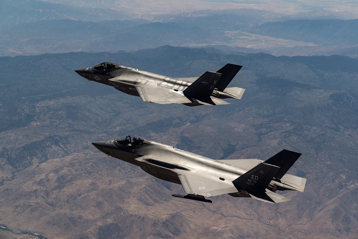 An F-35A and F-35C returning from a TR-3 flight test mission over Edwards Air Force Base, California