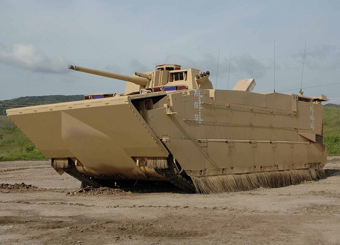 Expeditionary Fighting Vehicle prototype planing across water at high speed, demonstrating the water-skimming capability that drove its extreme cost and complexity