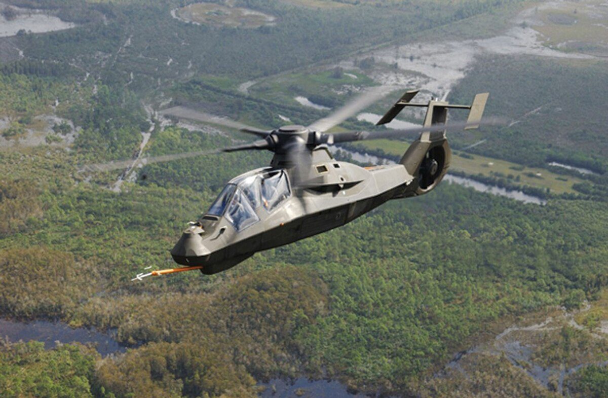 RAH-66 Comanche stealth reconnaissance helicopter prototype in flight, the angular fuselage showcasing its radar-evading design that never entered production