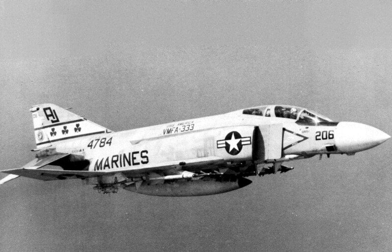 F-4 Phantom II in flight with MARINES marking visible on the fuselage