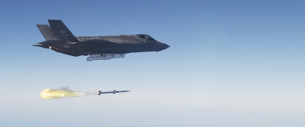 F-35 Lightning II launching an AIM-120 AMRAAM missile over the California coast during weapons testing