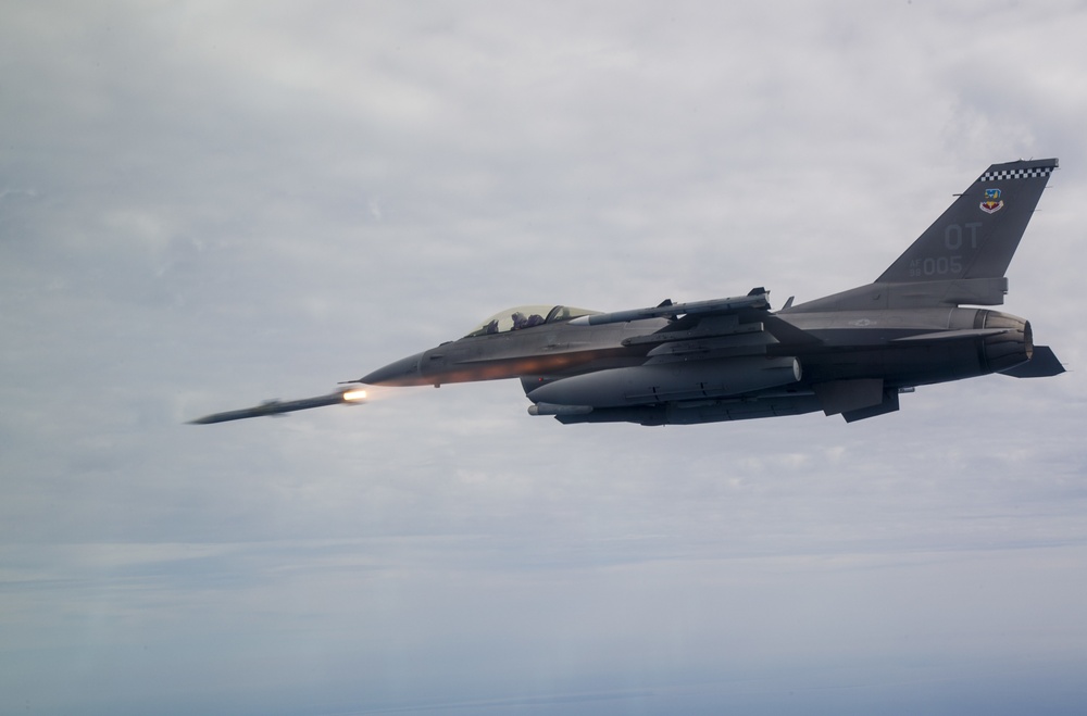 F-16C Fighting Falcon firing an AIM-120 AMRAAM missile during weapons testing over Eglin Air Force Base