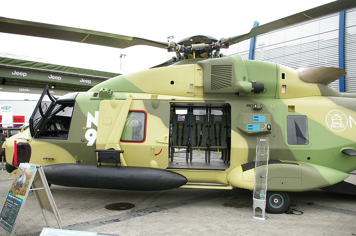 NH90 military helicopter in green camouflage on static display showing its all-composite airframe