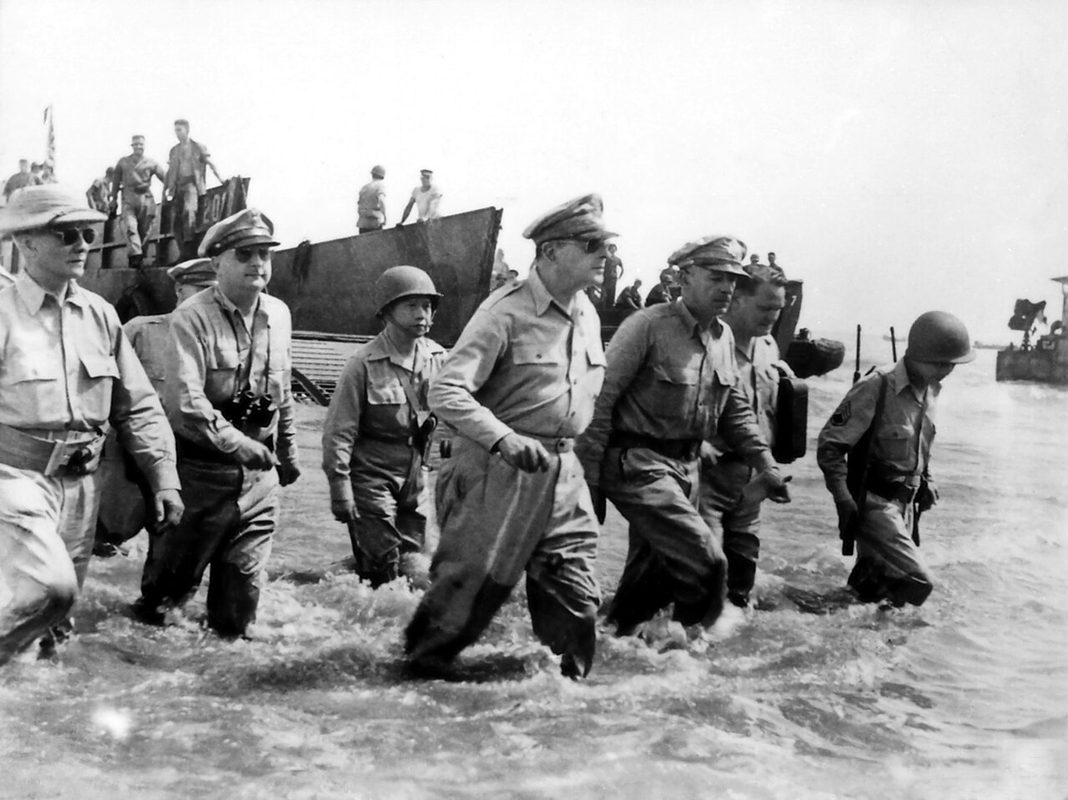 General Douglas MacArthur wading ashore at Leyte in the Philippines in October 1944