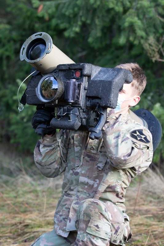 U.S. Army soldier aiming a Javelin anti-tank missile system with the Command Launch Unit attached during a training exercise