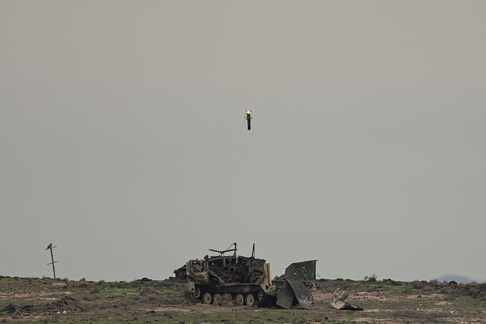 A Javelin missile being removed from its sealed transport and launch canister during training preparation at Orchard Combat Training Center