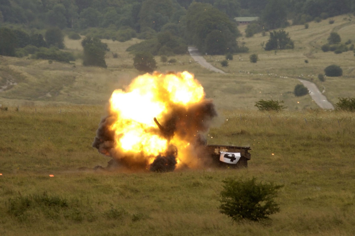 Armored vehicle target being engaged during live-fire gunnery qualification at Udairi Range Complex in Kuwait