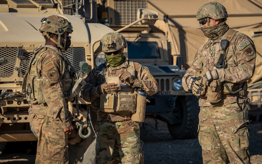 Air Force weather forecasters analyzing data for combat mission planning