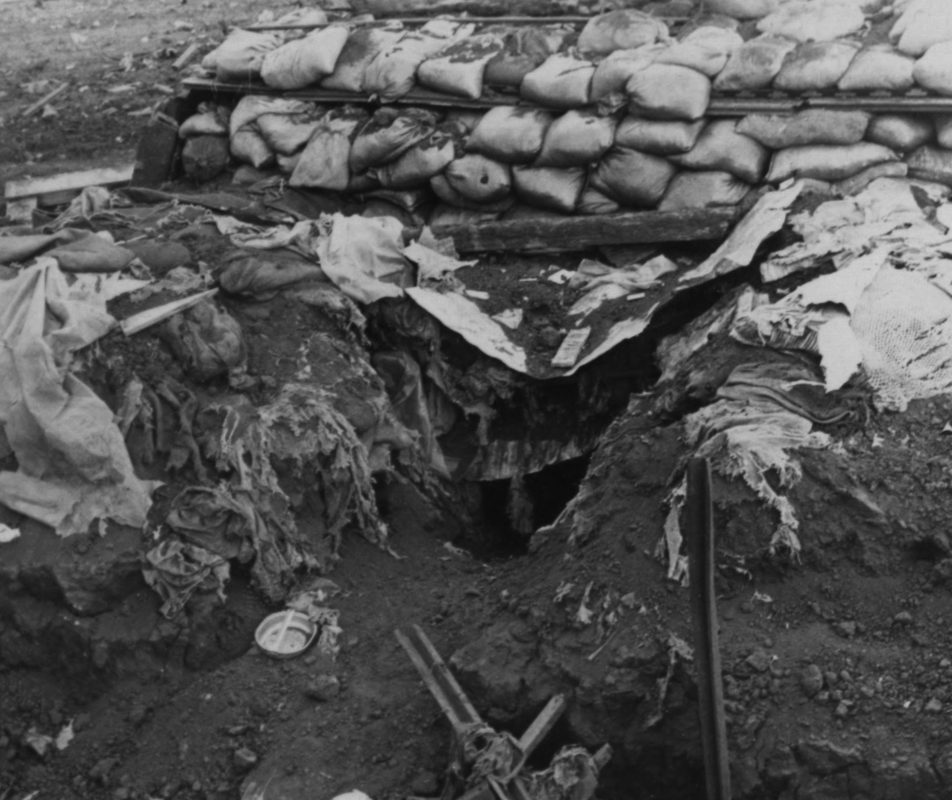 US Marines in a sandbagged bunker at Khe Sanh combat base looking out over the perimeter during the siege