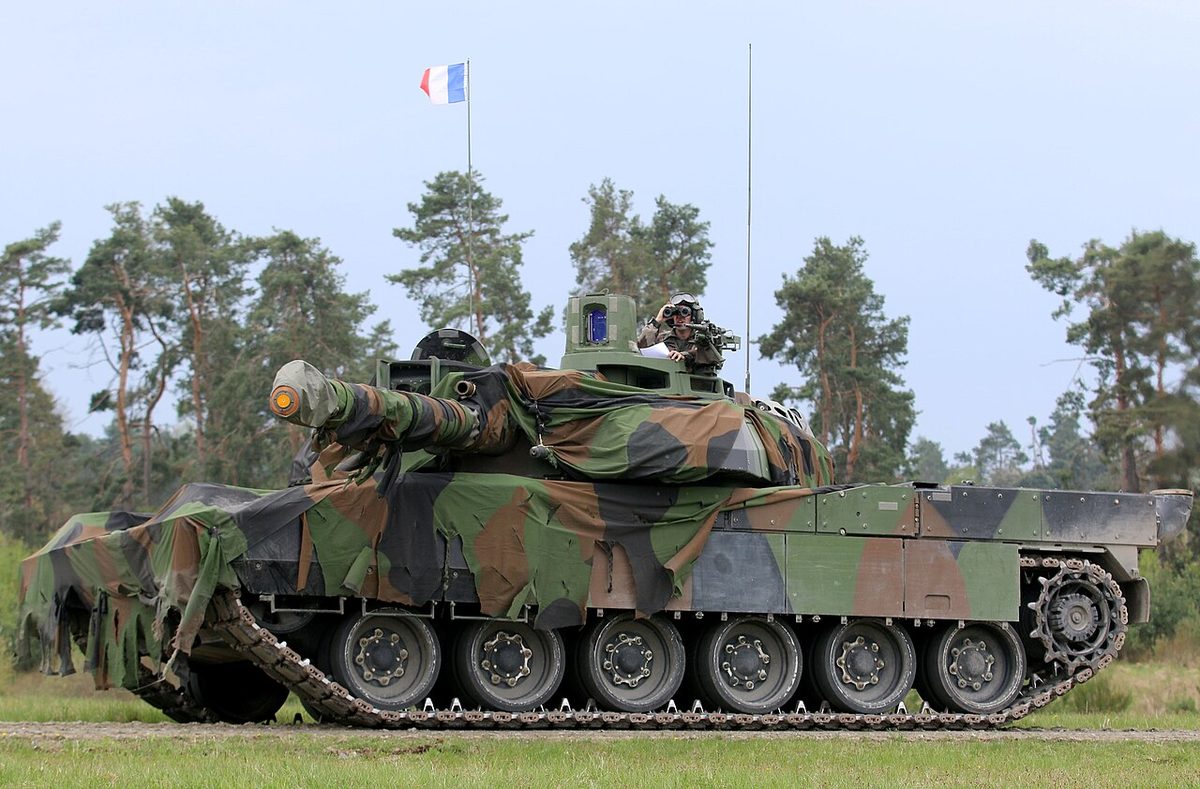 Leclerc tank with French flag during a field exercise showing its side profile