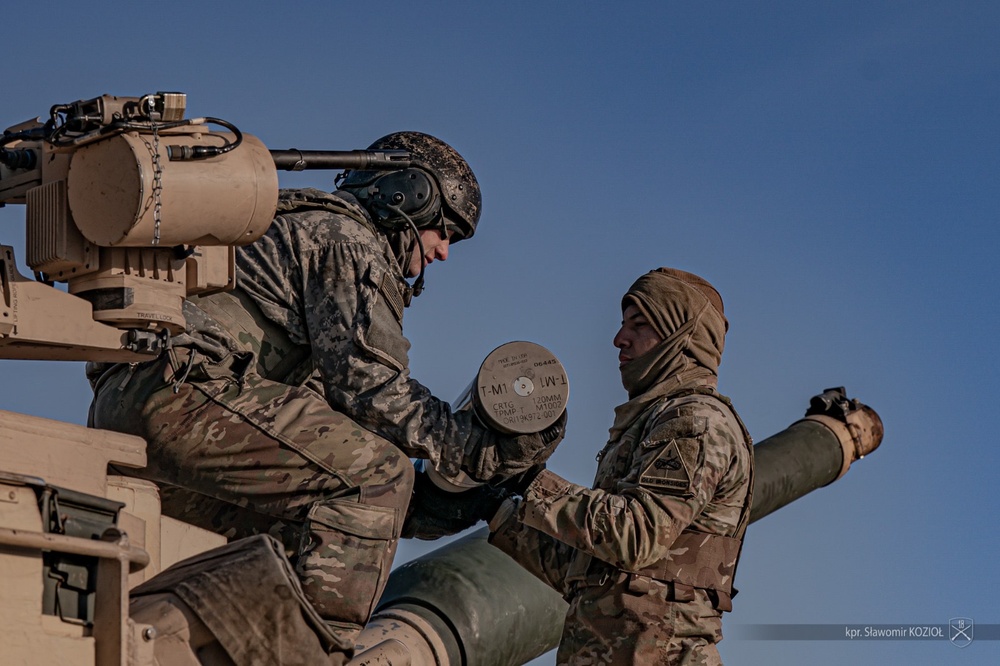 Polish tank crews training on M1A2 Abrams tanks with U.S. Army instructors