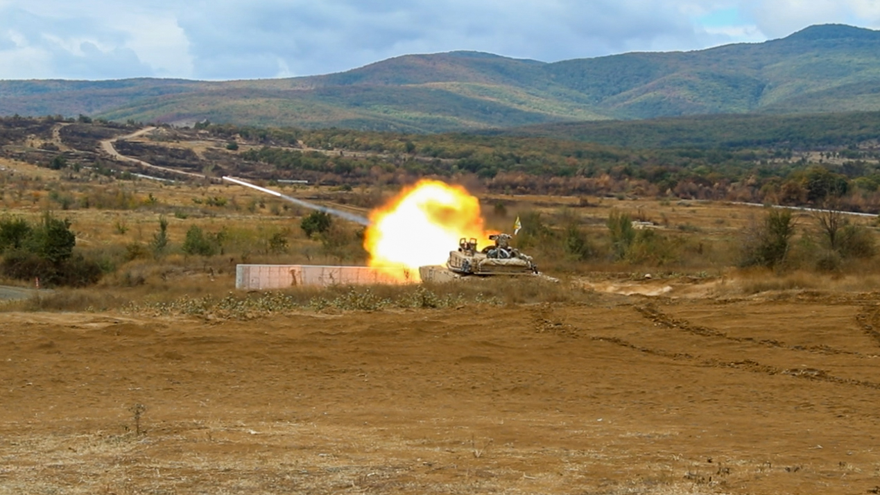 M1A2 SEPv3 Abrams tank firing its main gun during live-fire training exercise
