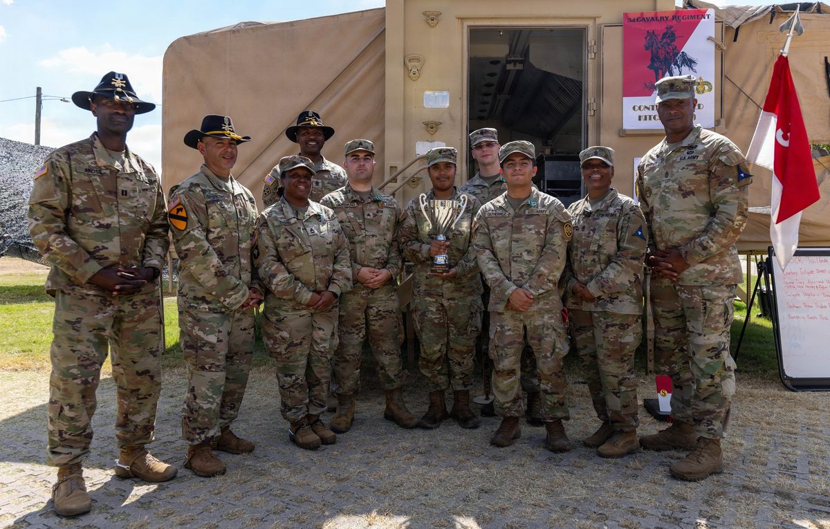 U.S. Army soldiers operating a field kitchen preparing hot meals during a training exercise