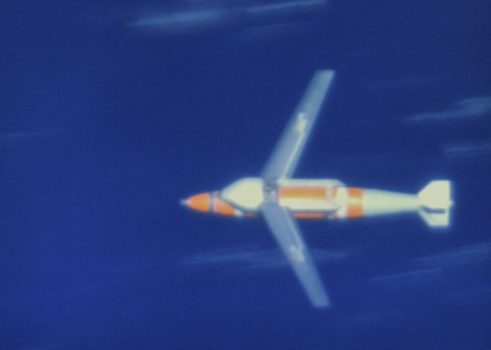 Quickstrike-ER extended range naval mine during testing over the Pacific Ocean showing deployed wings