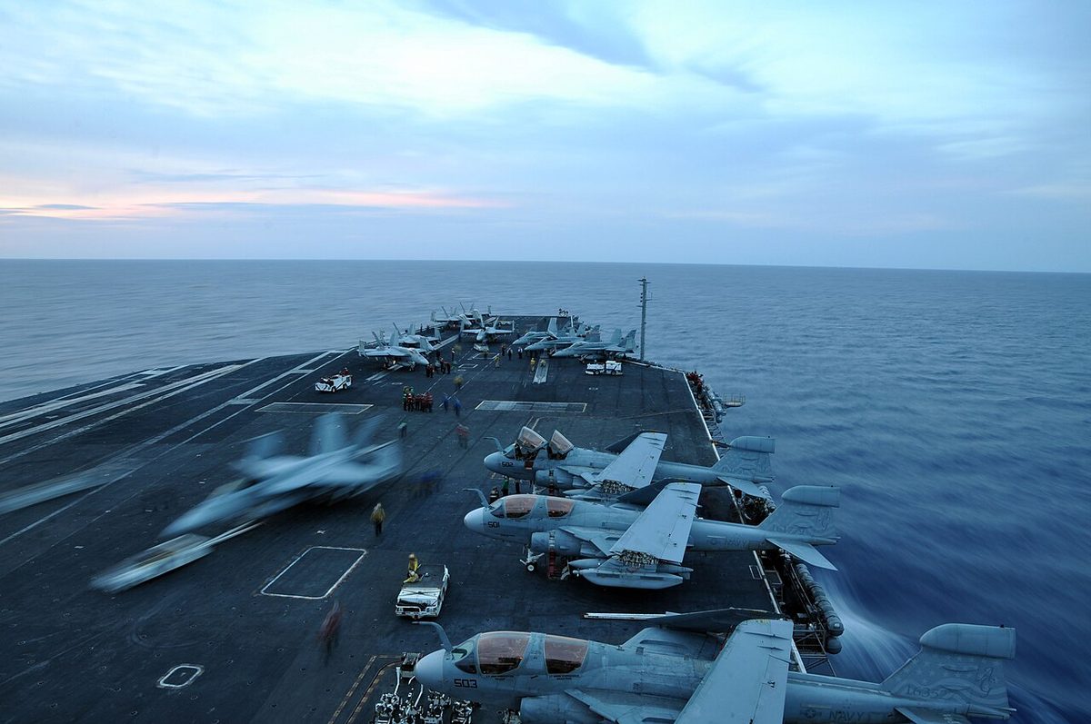 Carrier air wing aircraft on the flight deck during night operations