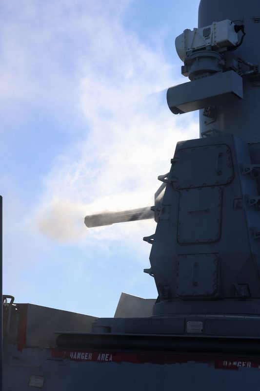 Smoke rising from the barrel of a Phalanx CIWS after a live fire exercise aboard USS Truxtun