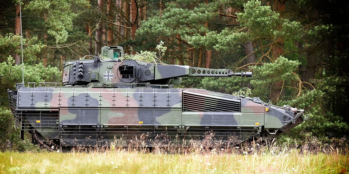 Puma IFV side profile in vegetation showing the full vehicle configuration