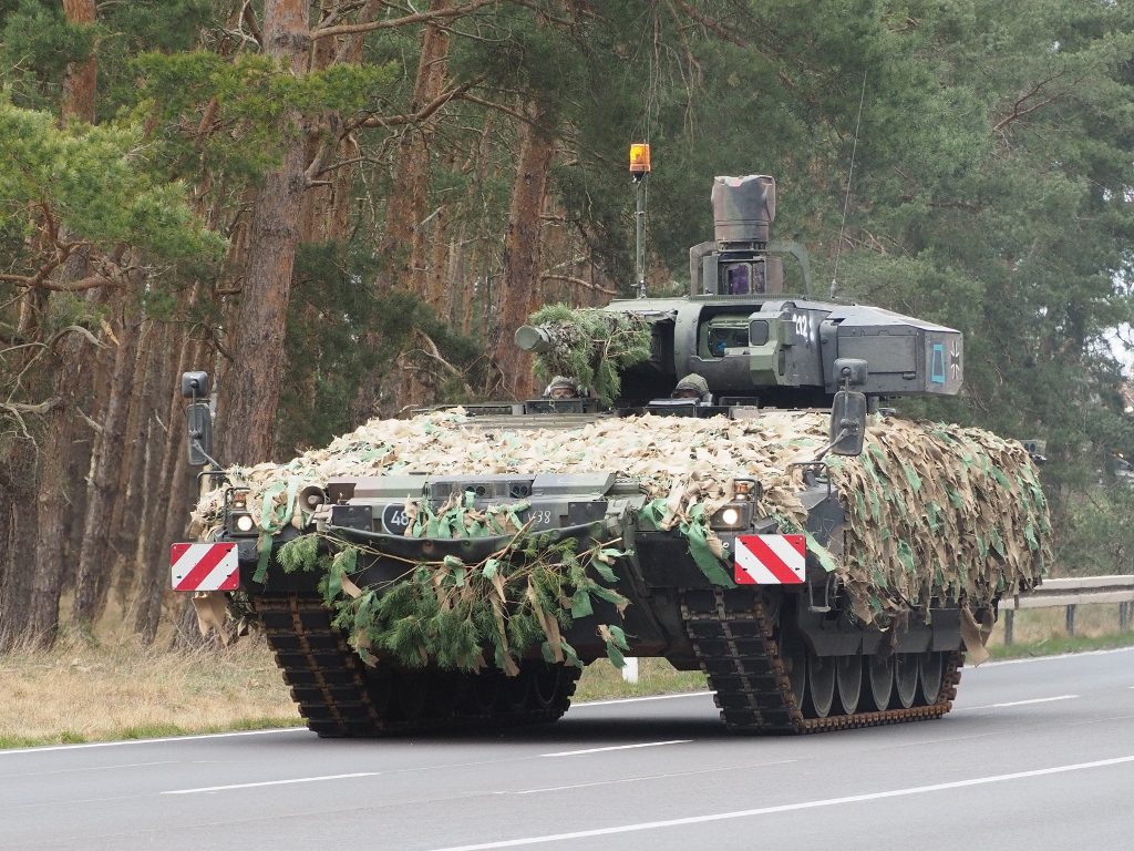 Puma IFV with camouflage netting showing the Lance turret with 30mm cannon